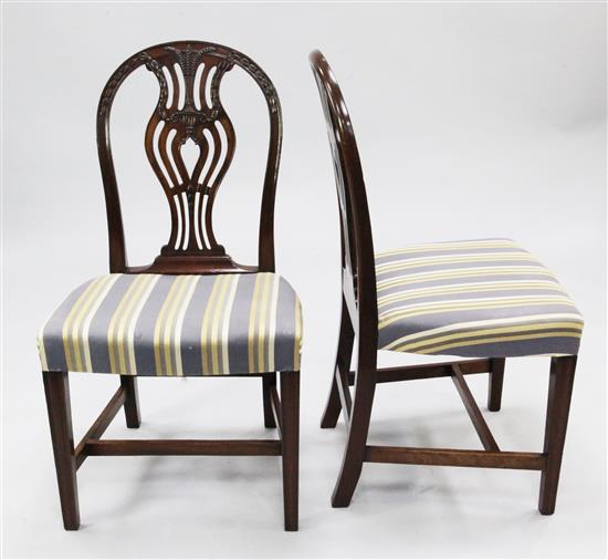 A set of ten Hepplewhite style carved mahogany dining chairs,